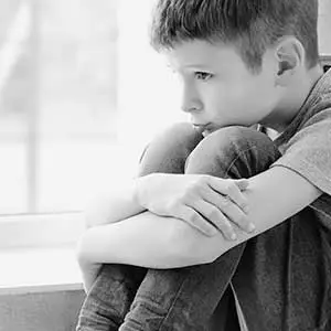 Child appearing withdrawn, symbolising high emotional and mental health needs